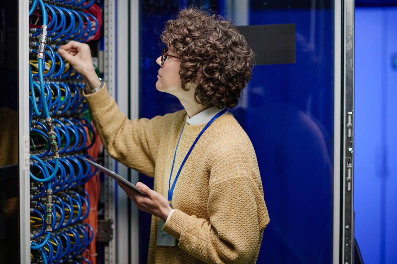 big data issues and challenges - technician using networking gear